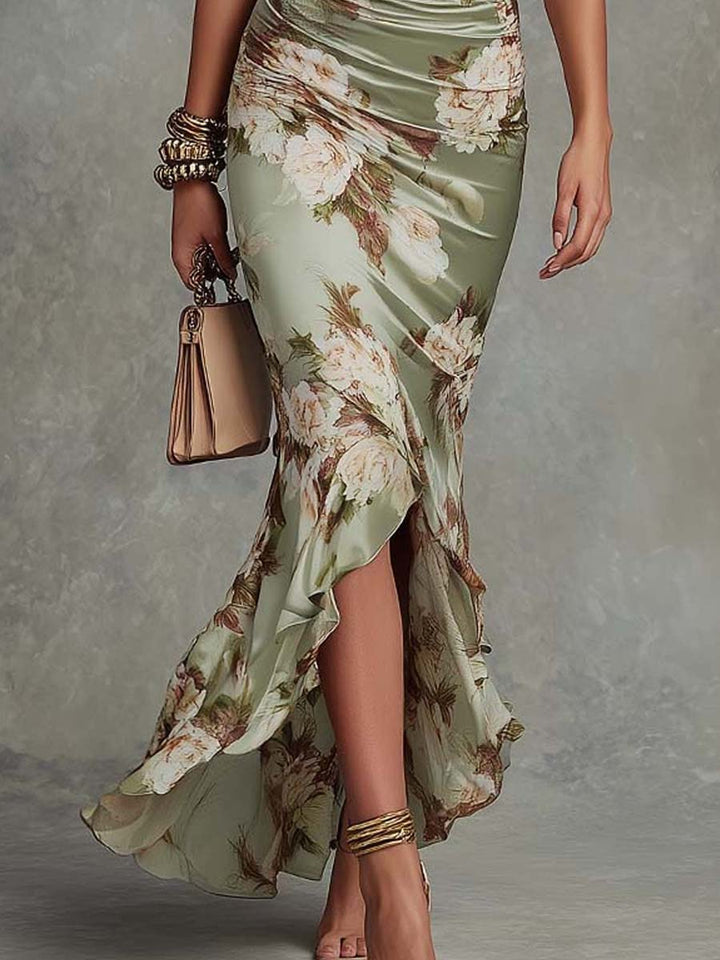 Anna - Asymmetrical long satin dress in green with V-neck, bell sleeves, and floral pattern