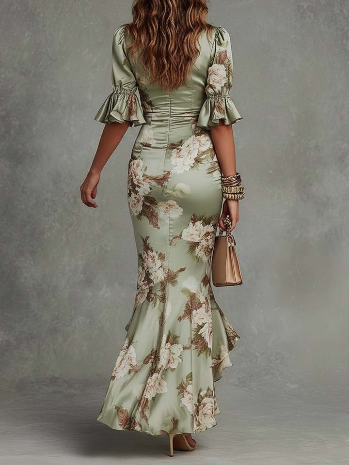 Anna - Asymmetrical long satin dress in green with V-neck, bell sleeves, and floral pattern