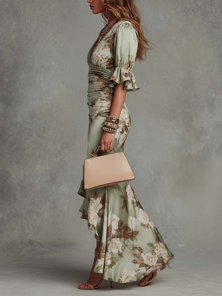 Anna - Asymmetrical long satin dress in green with V-neck, bell sleeves, and floral pattern